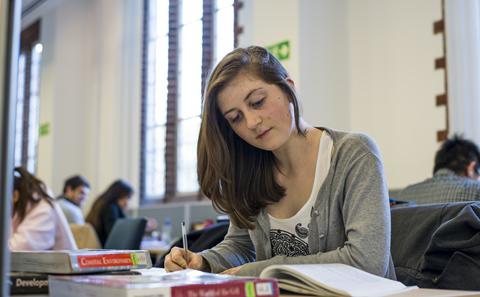 student studying in the library