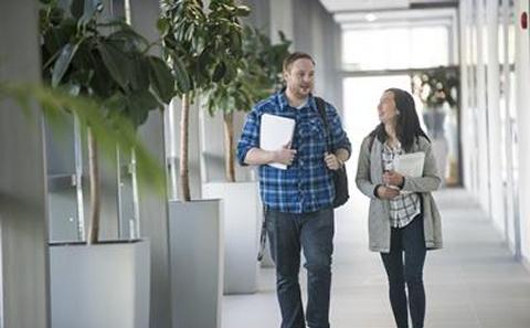 Students walking down corridor