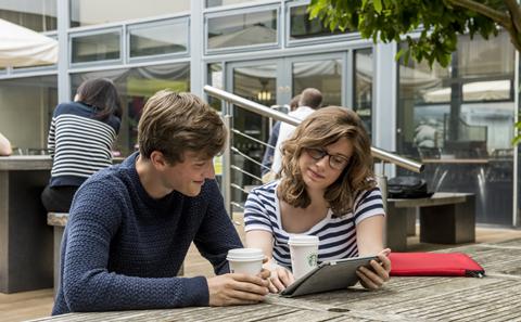 Two students sitting and talking