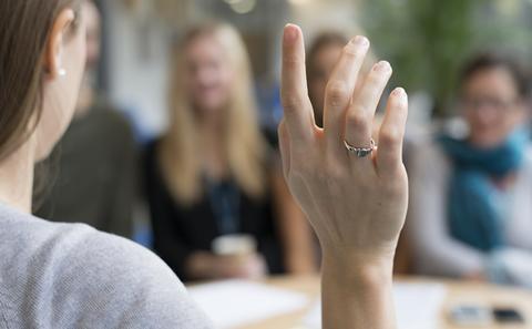 Person raising their hand