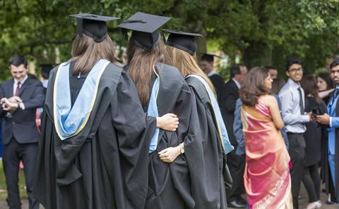 Group of students have picture taken at graduation
