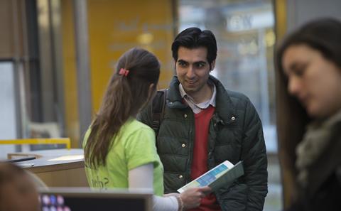 A student and advisor at the Student Services Centre