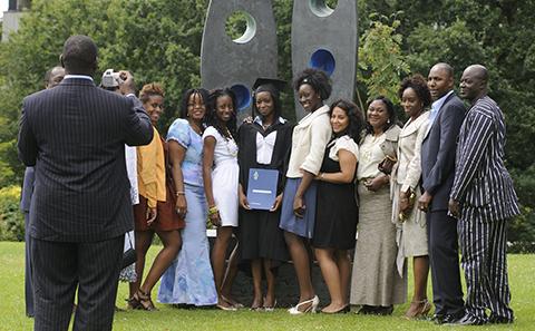 A graduating student with family