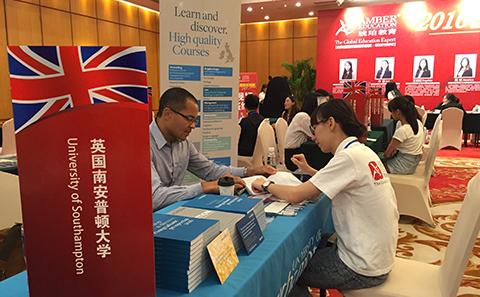 Student getting help at an overseas exhibition