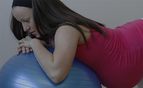 Pregnant woman on exercise ball