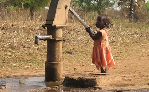 Image of child at water pump