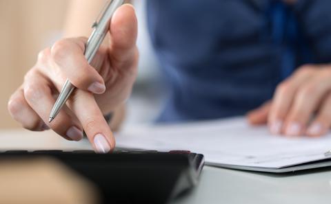 A person works on their finances