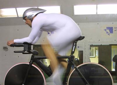 Cyclist on a bike in the RJ Mitchell Tunnel