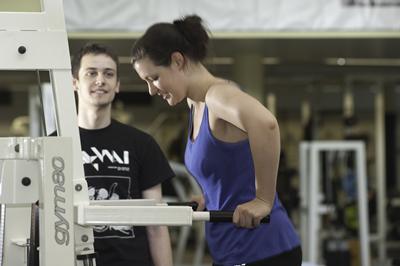 Woman smiling on exercise bike