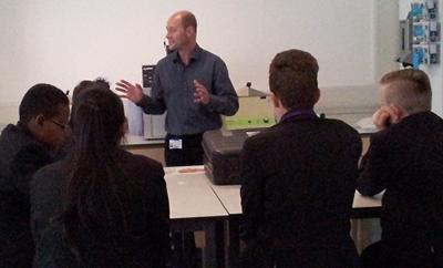 Dr Rod Hervé talking to secondary school students