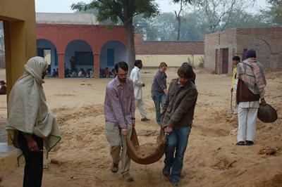 Carrying sand for water tank foundations