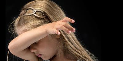 girl covering her face