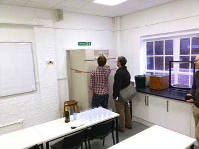 Dr. Sam Keyes and Prof. Ian Sinclair inspecting the plant growth chamber