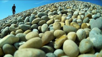 The silhouetted figure of Paul Heckles, our professional remote aircraft systems pilot, retrieves the plane