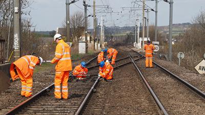 Workers on rail network