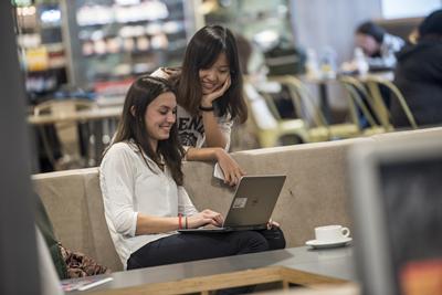 Two students with a laptop