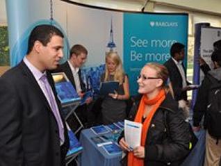 Employer speaking with a student at a career fair