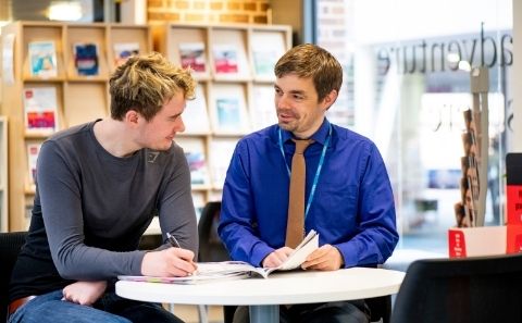 Student speaking to an adviser