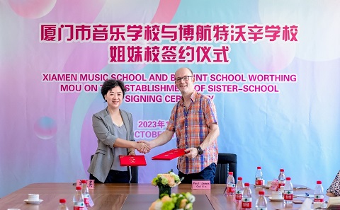 Chinese and British teacher smiling