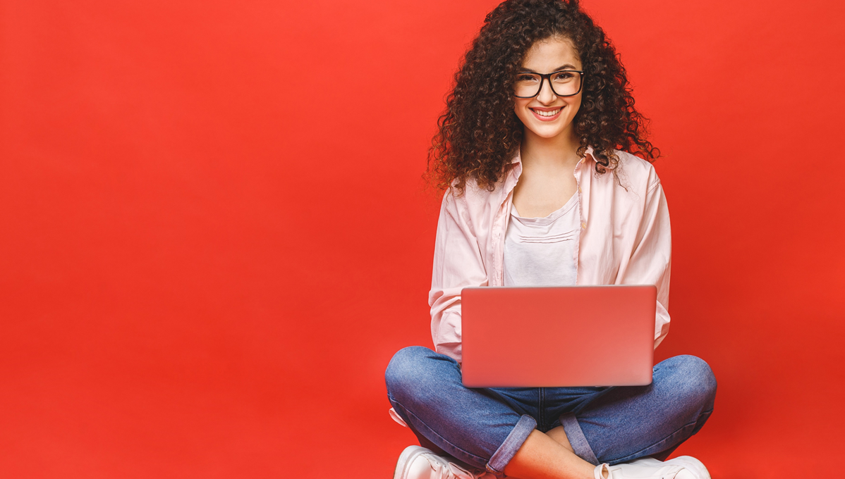 Text reads 'Blackboard & VLE Awards: what student value in online learning - some common themes'. A female student is shown working enthusiastically on a laptop 
