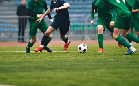 A group of individuals playing a football match.
