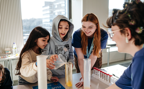 Three children doing a science experiment