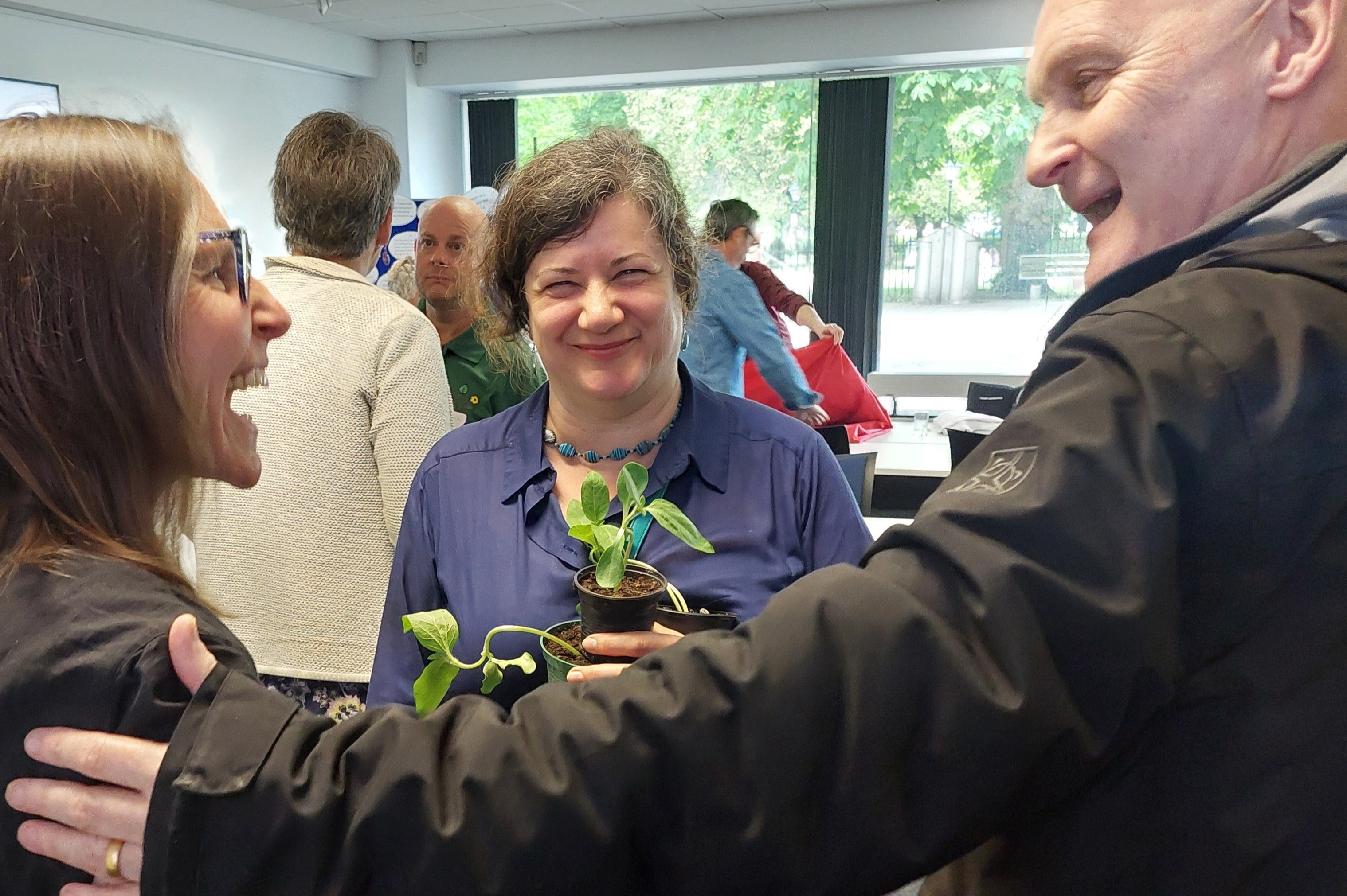 people greeting each other at a networking event.