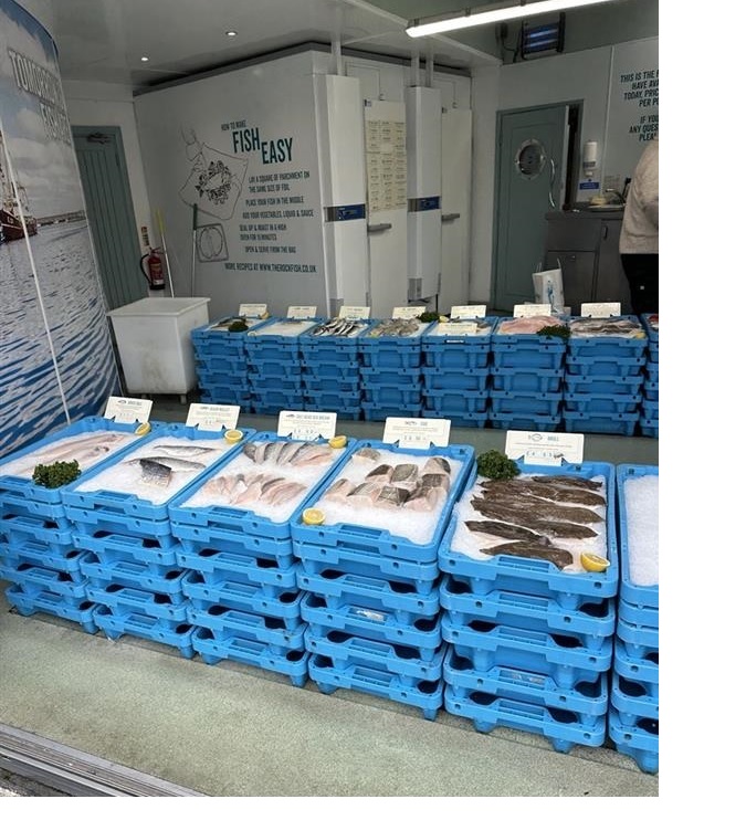 Boxes with fresh fish in ice