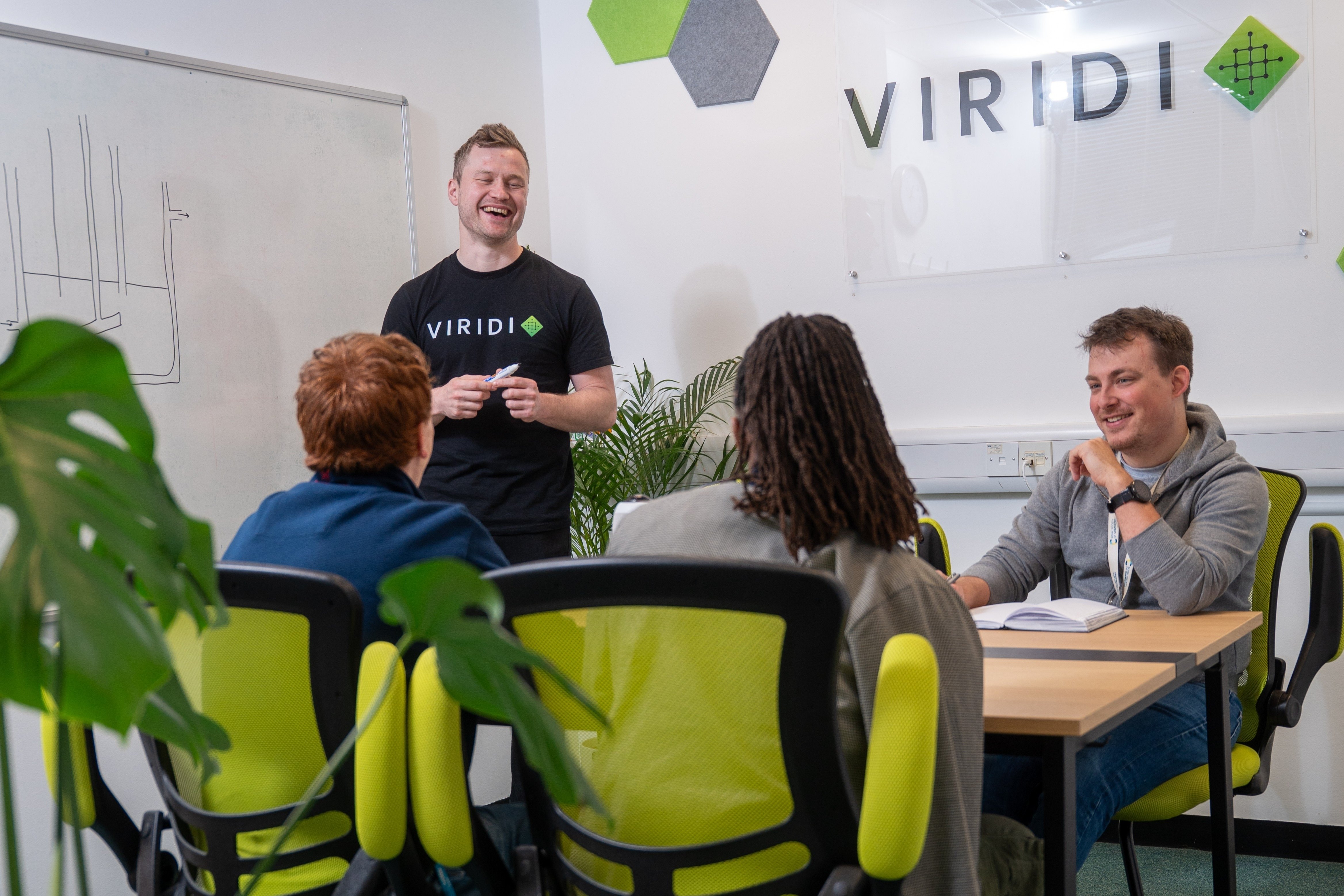 Dan Stewart leading a team meeting at Viridi's offices.