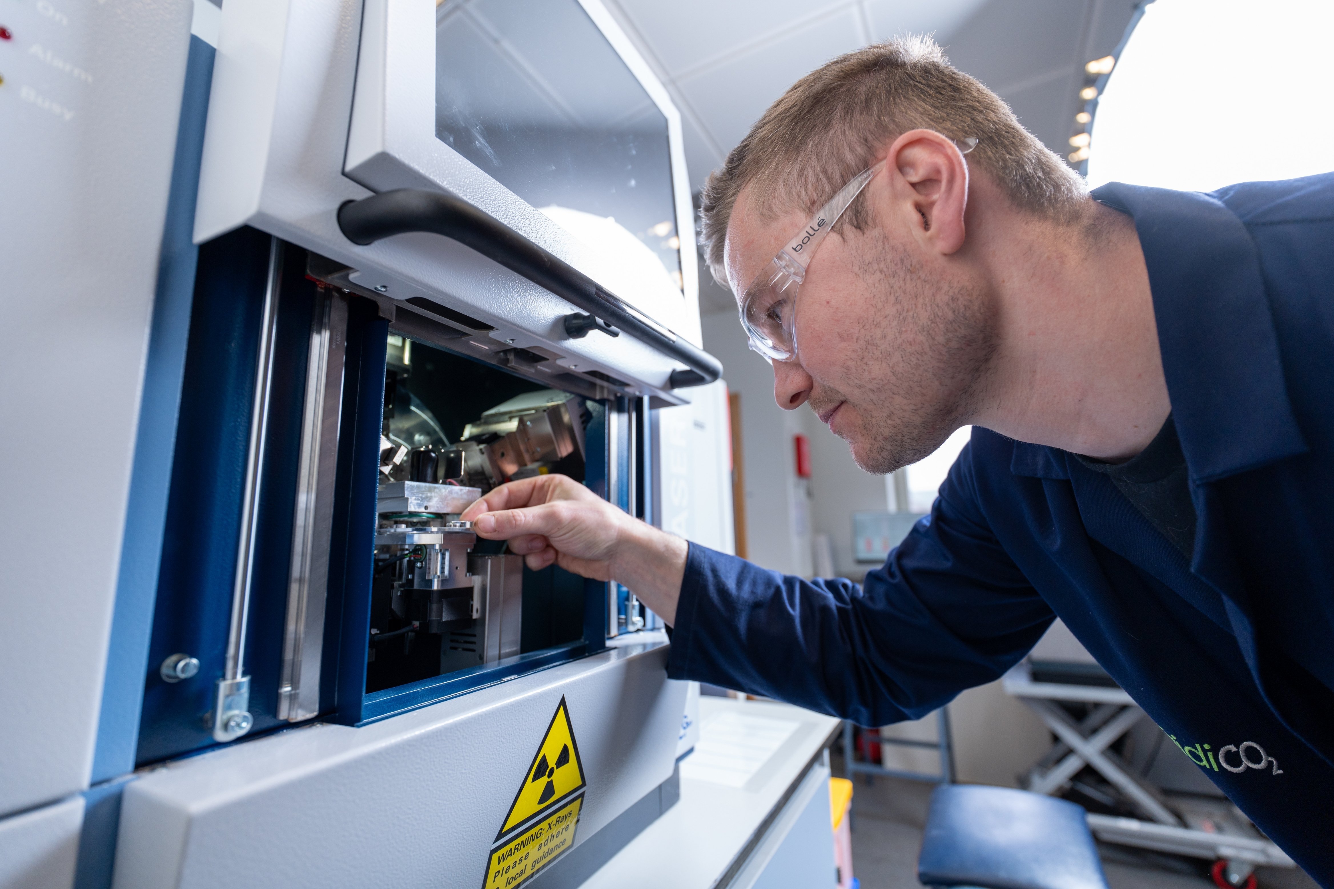 Dan Stewart operating scientific analysis equipment in the laboratory.
