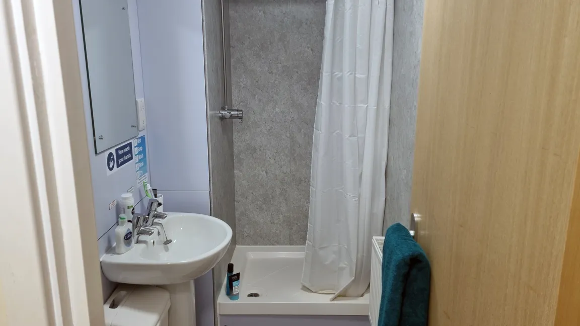 Standard shared bathroom with wash basin