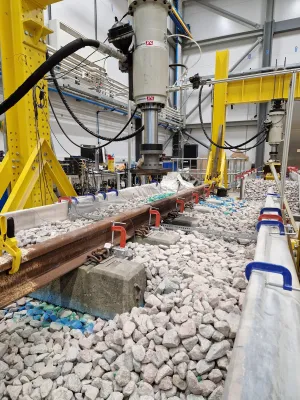 A portrait photo of a full-scale test track housed within the National Infrastructure Laboratory.