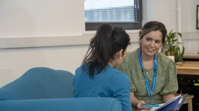 Adviser and student in conversation. 