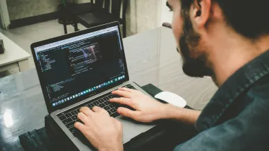 A person coding on their computer
