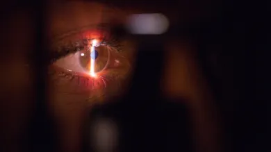 A person having their eye scanned