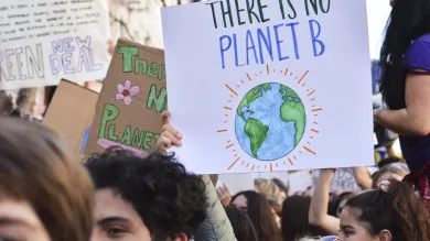 Peaceful protesters holding placards at a climate change rally