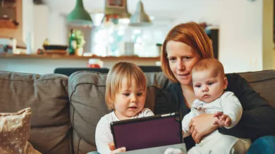 Mum with children using a tablet
