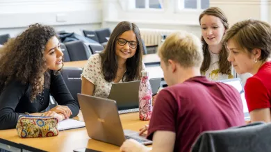 Modern Language students discussing laptop contents