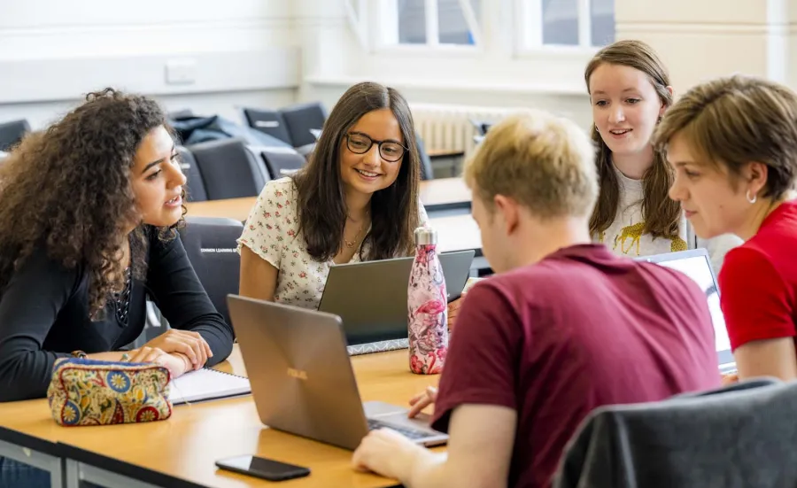 Modern Language students discussing laptop contents