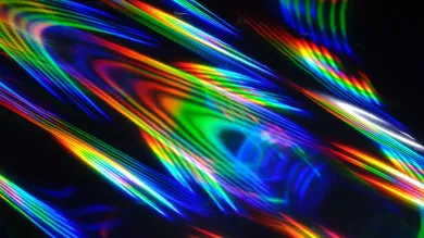 Holographic patterns of light against a black background