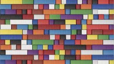 A colourful checkerboard of shipping containers viewed from a great height