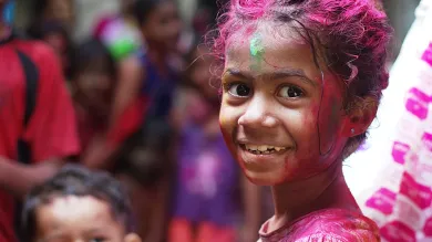 Selective focus photo of girl in shirt smiling 
