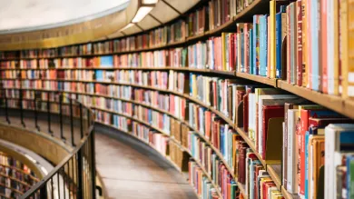 Rows of books on shelves in a library