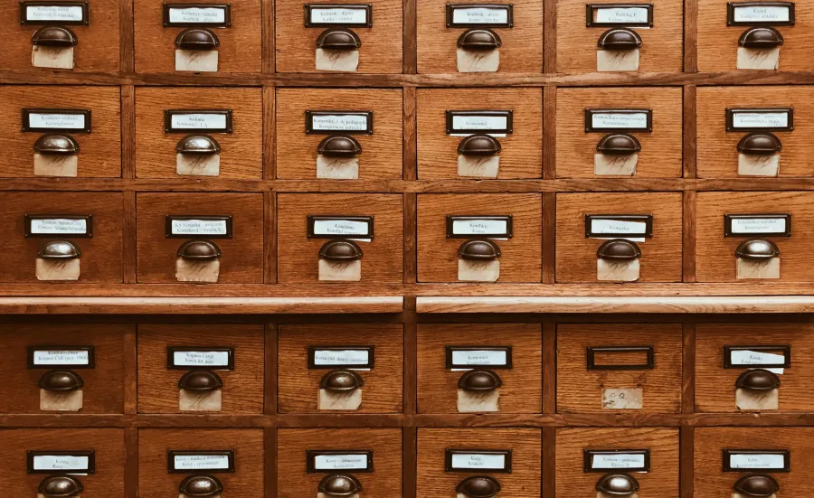 A block of wooden card catalogue drawers