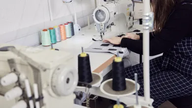 Woman using an industrial sewing machine