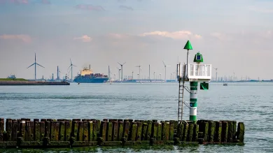 A cargo ship leaving a harbour