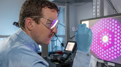 A man arranging microstructured fibre inspection
