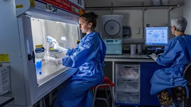 Two people work in a lab