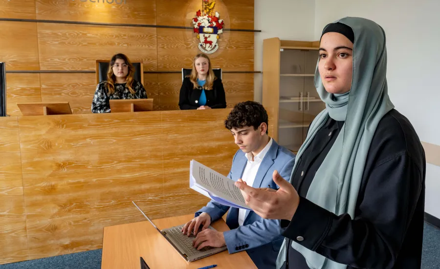 Law students participating in a moot court session.