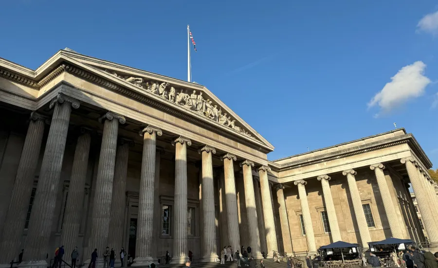 The front of the British Museum on a sunny day. 